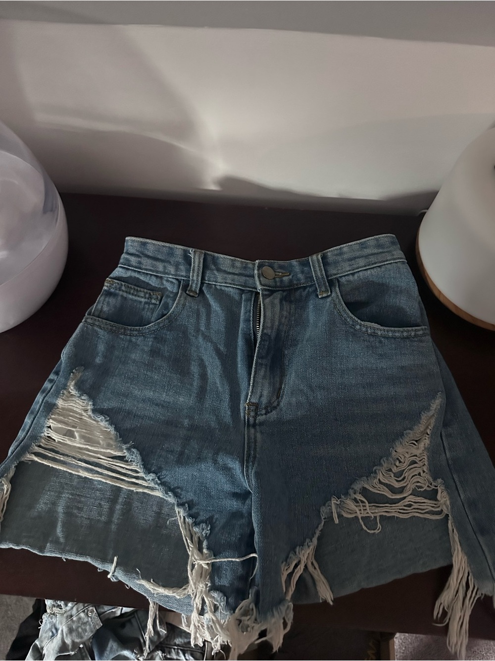 High-Rise Distressed Denim Jean Shorts in Blue